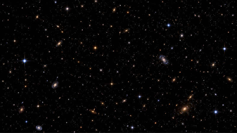 Stars photographed from space by the Hubble Space Telescope appear as sharp steady points of light with no twinkling because there is no atmosphere to bend the starlight